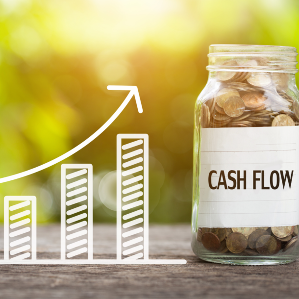Chart of cash flow increasing with a jar of coins labeled "cash flow"