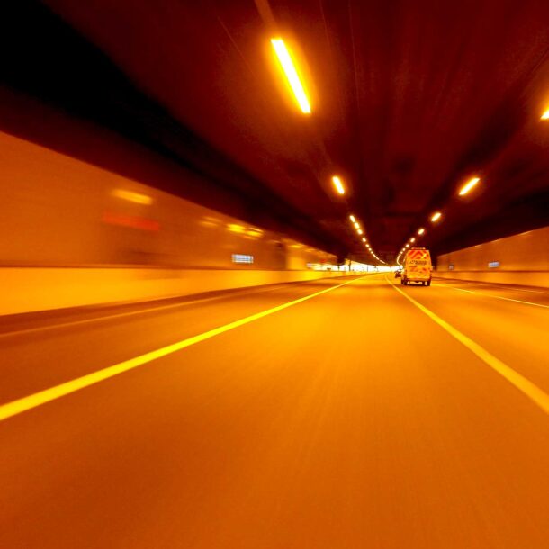 motion shot of van traveling through a tunnel