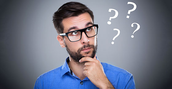 Photo of an individual in a thinking post with question marks depicting their contemplation.