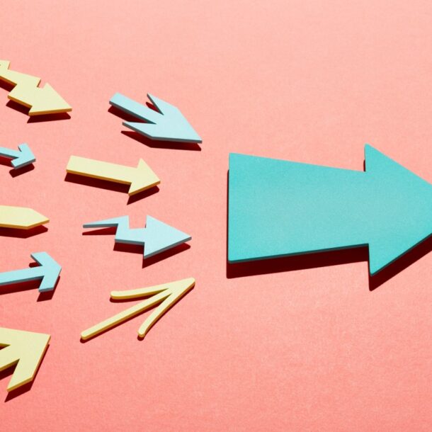 Multiple various shaped arrows decreasing in size from left to right towards one big solid arrow to show integration.